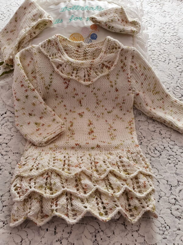 knitting pattern for a baby girls pixie style dress/bodysuit