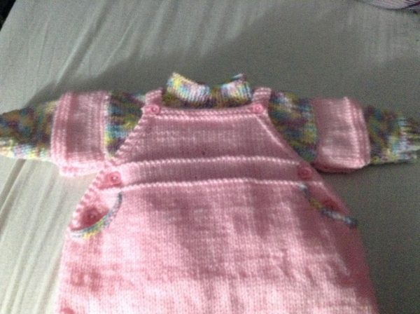 baby dungaree dress knitted by a customer