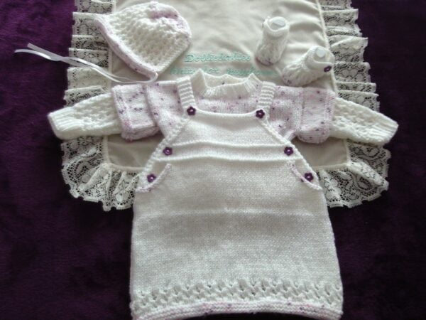 Knitting pattern for a baby girls dungaree dress and sweater set